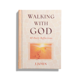 A cover image of a book by J.John titled 'Walking with God' featuring a desert landscape with a setting sun.