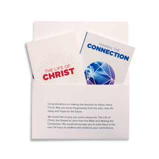 An open Response Pack with its contents displayed, including The Life of Christ, Making the Connection by J.John, and a response envelope.